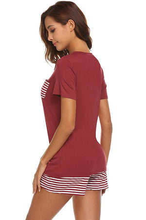 Burgundy V-neck lounge set with striped pocket and shorts.