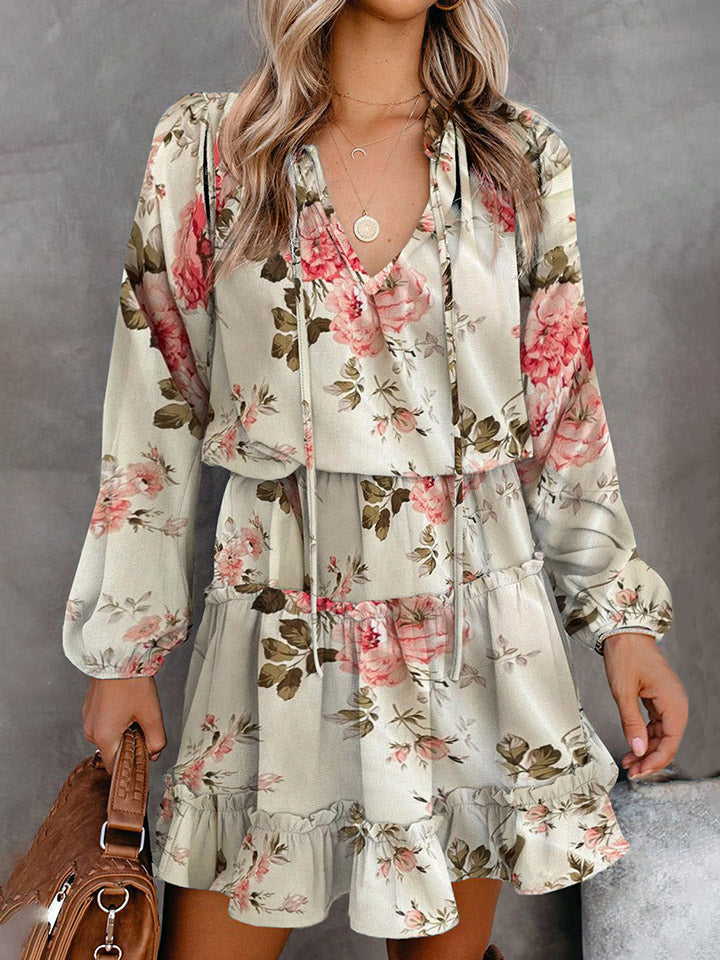 Ivory floral print tiered mini dress with tie neck and ruffled hem