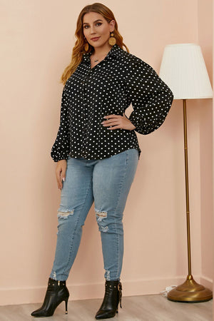 Black polka dot blouse with shirred balloon sleeves and a collared neckline.