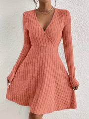 Burnt Coral ribbed wrap mini dress with long sleeves and a V-neck.