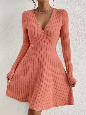 Burnt Coral ribbed wrap mini dress with long sleeves and a V-neck.