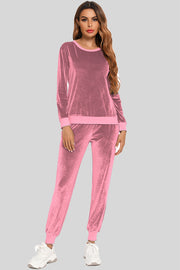 Dusty Pink velvet lounge set with contrast trim, crew neck, long sleeves, and jogger pants.