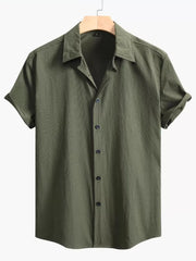 Army green textured cotton Cuban collar casual shirt with button-down front and cuffed short sleeves.