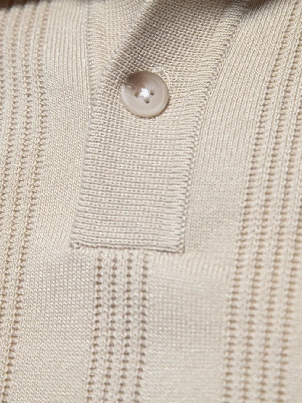 Beige textured ribbed knit polo shirt with a single button closure.