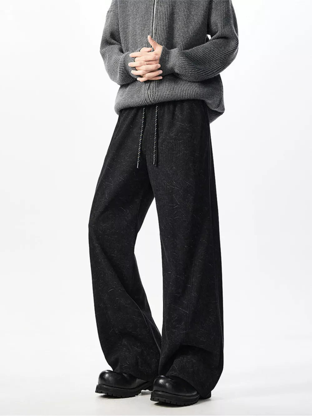 Textured black wide leg drawstring sweatpants with a relaxed fit.