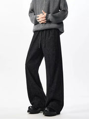 Textured black wide leg drawstring sweatpants with a relaxed fit.