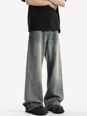 Men's relaxed fit vintage wash jeans in a baggy, casual style.