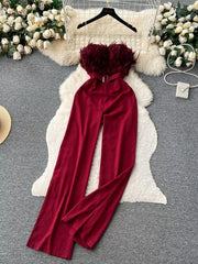 Wine red strapless wide-leg jumpsuit with feather trim and belt