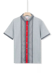 Men's gray short sleeve shirt with bold geometric print and red button placket.