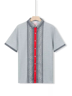 Men's gray short sleeve shirt with bold geometric print and red button placket.