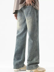 Men's light blue vintage wash drawstring jeans with a relaxed fit.