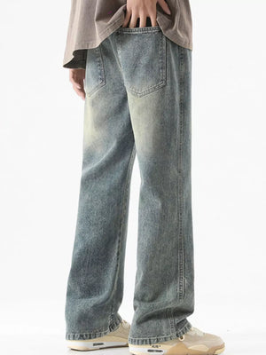 Men's light blue vintage wash drawstring jeans with a relaxed fit.