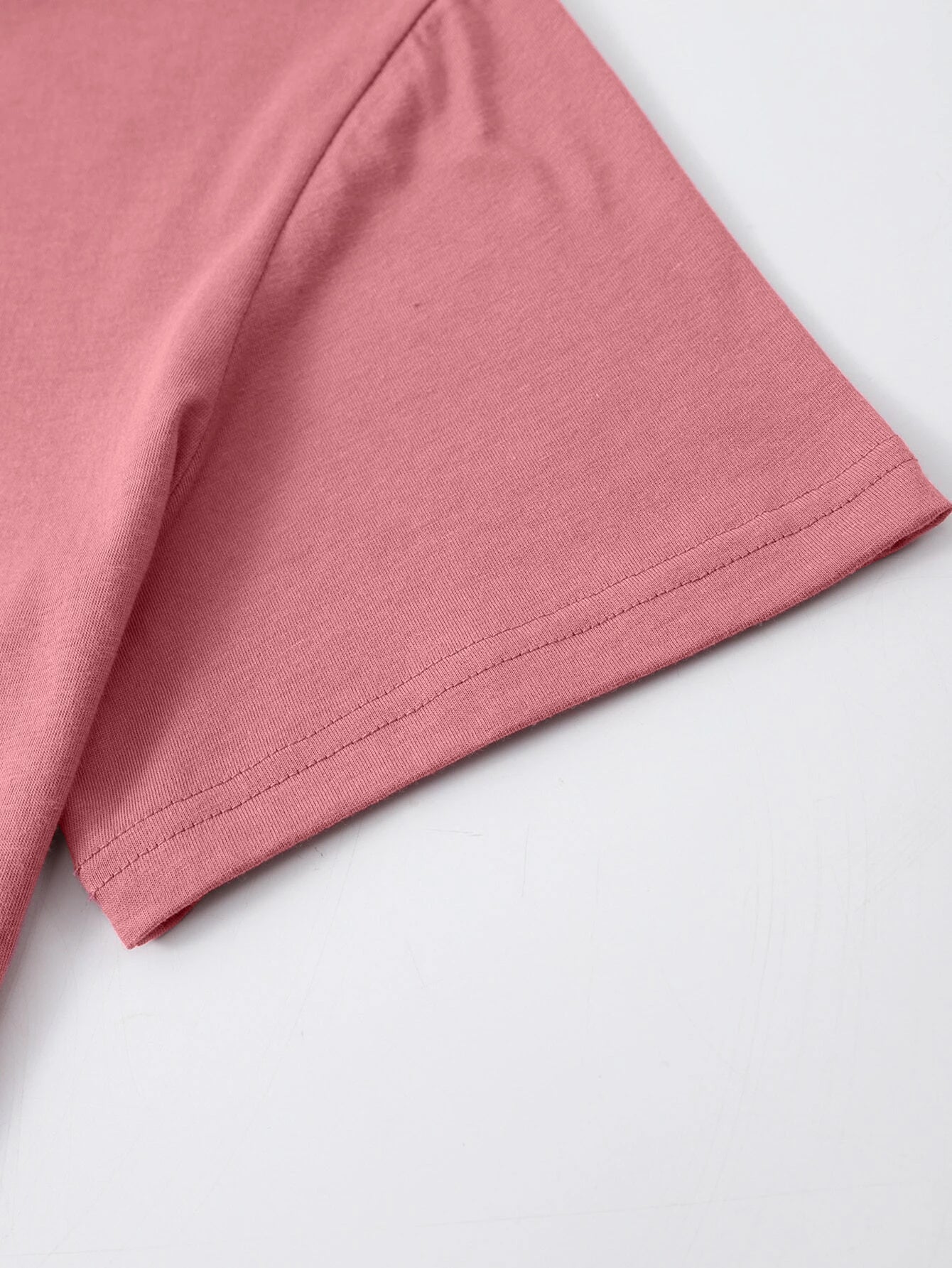 Pink short sleeve t-shirt with double-stitched hem detail.