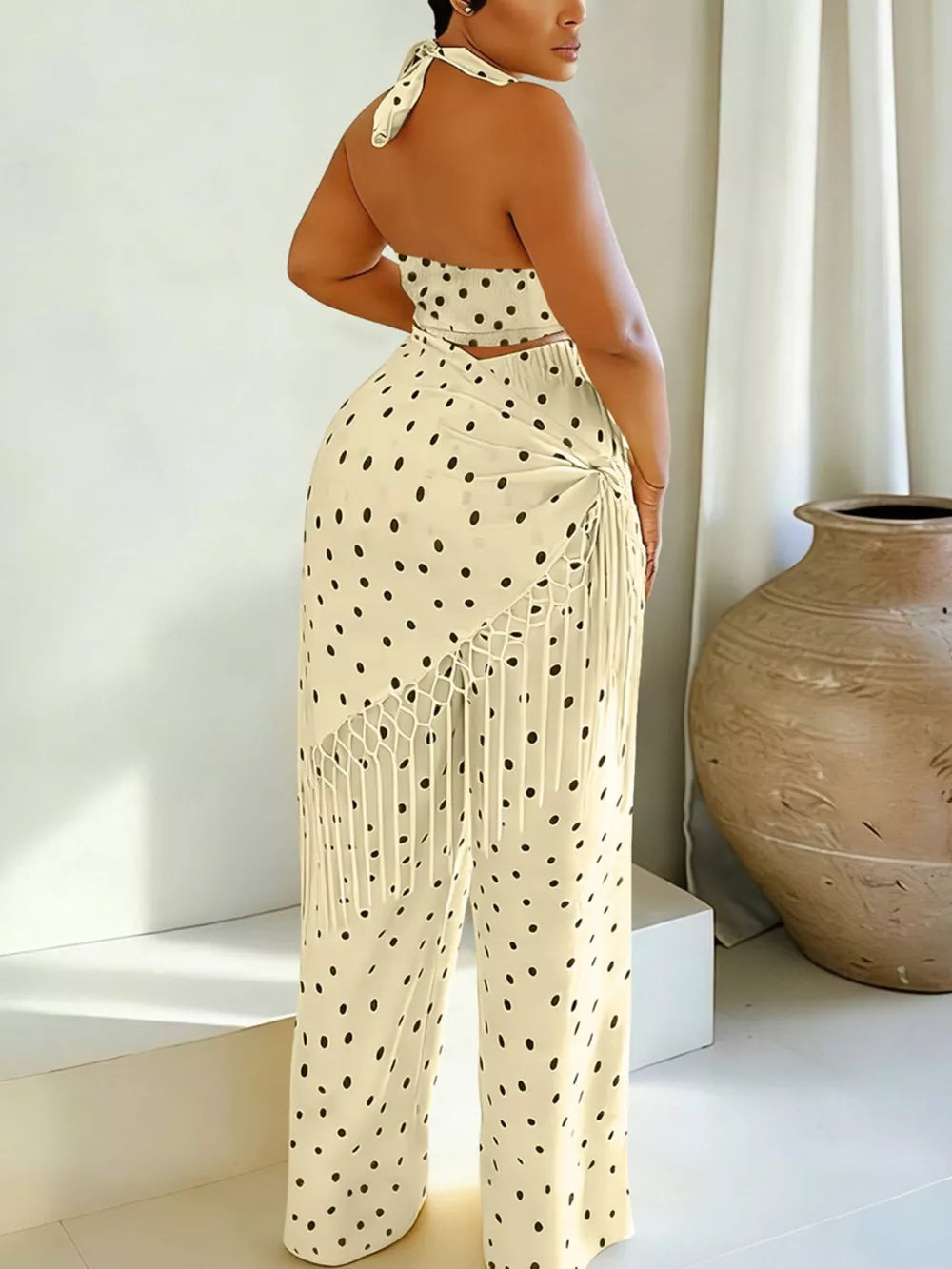 Cream polka dot cami and fringe wide-leg pant set with halter neckline.