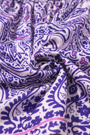 Paisley smocked bodice blouse in lavender with intricate purple and pink floral and paisley print.