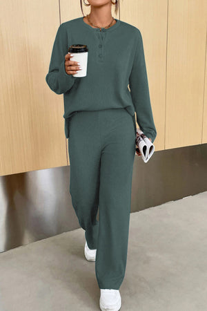Relaxed ribbed henley set in dark green with buttoned neckline and wide leg pants.