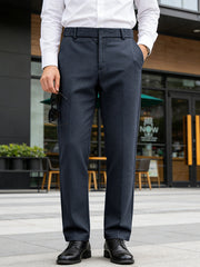 Classic fit navy dress pants with pockets, styled with a white dress shirt and black dress shoes.