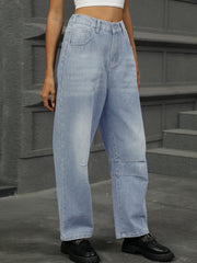 Relaxed light wash denim trousers with patchwork detail and wide leg.