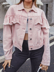 Blush pink denim trucker jacket with frayed ruffle details on the sleeves and chest.