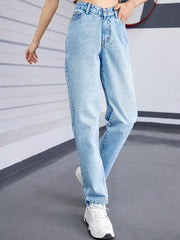 Light wash denim jeans with a V-waistline and relaxed fit.