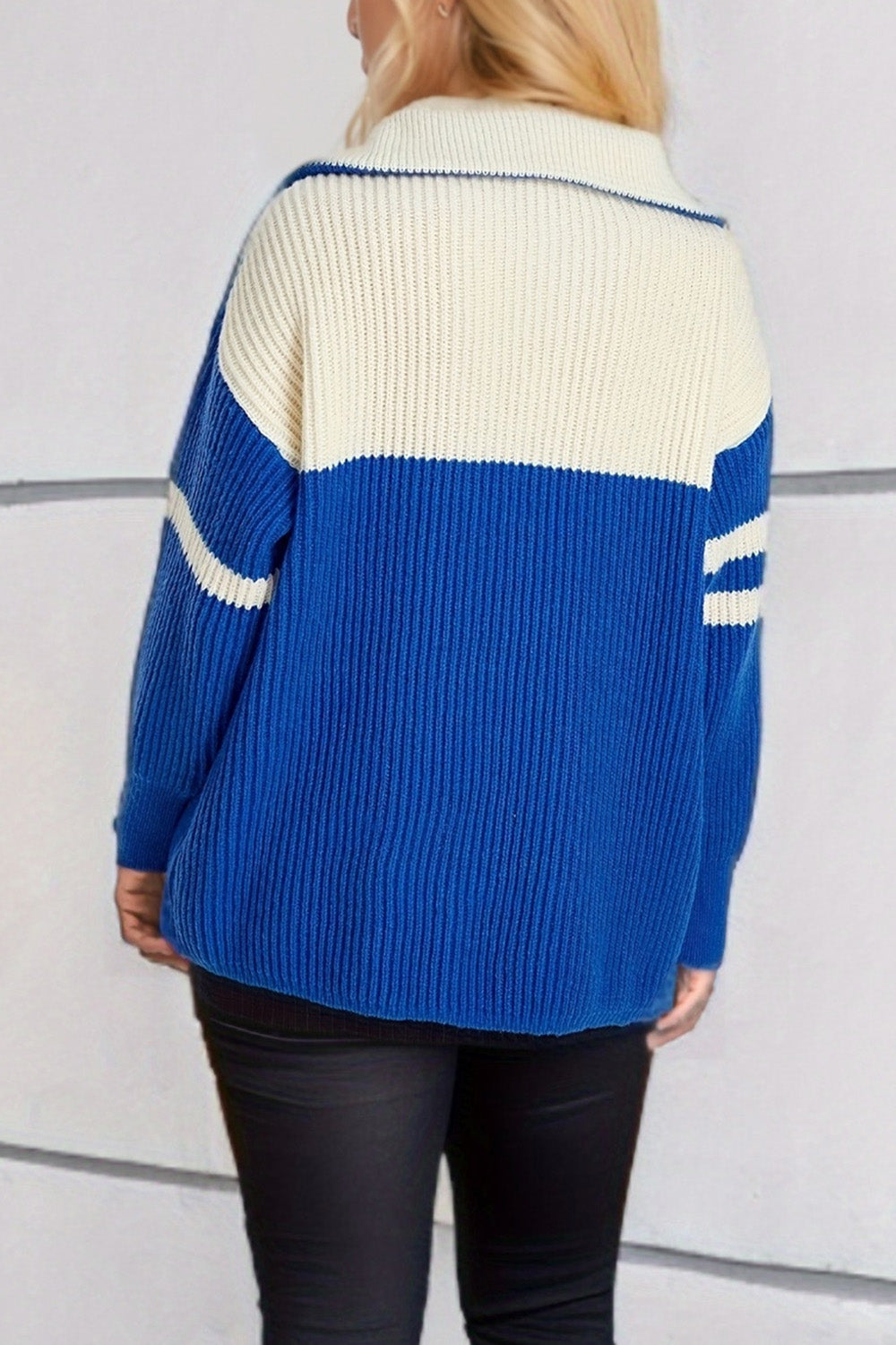 Ribbed knit quarter-zip sweater in royal blue and cream with stripe detail on sleeves.