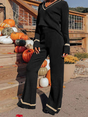 Black knit flare set with contrast trim on V-neck and cuffs, wide leg pants.