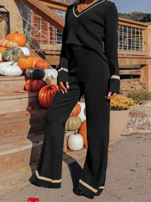 Black knit flare set with contrast trim on V-neck and cuffs, wide leg pants.