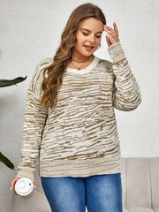 Zebra stripe relaxed fit knit sweater with crew neck and long sleeves.
