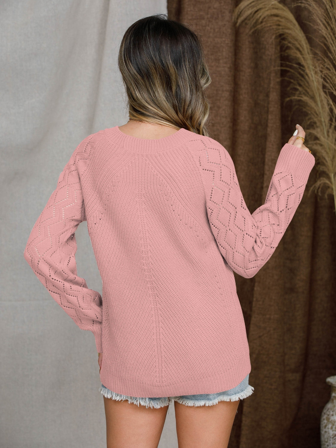 Diamond-cut raglan knit sweater in blue acrylic.