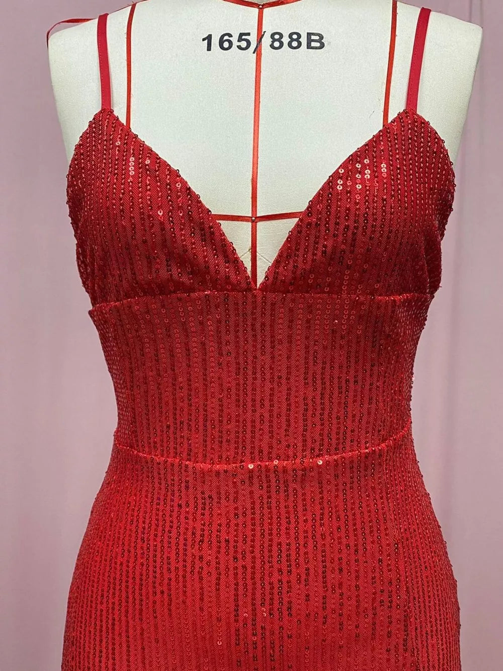 Big Red sequin maxi dress with V-neck and spaghetti straps.
