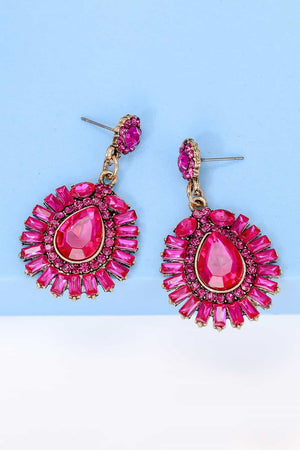 Hot Pink dangle earrings with a large teardrop gem surrounded by baguette and round crystals.