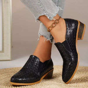 Black woven texture pointed loafers with block heels and elastic side panels.