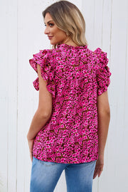 Floral ruffle sleeve blouse in pink with a notch neck and ruffled collar.