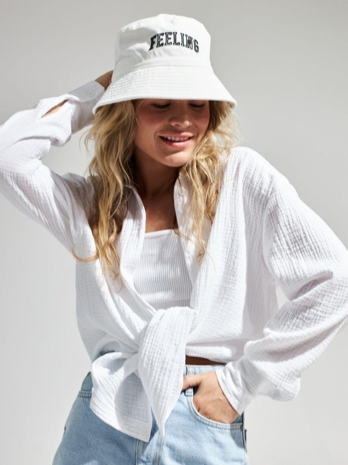 White textured cotton overshirt with relaxed fit, tied at waist
