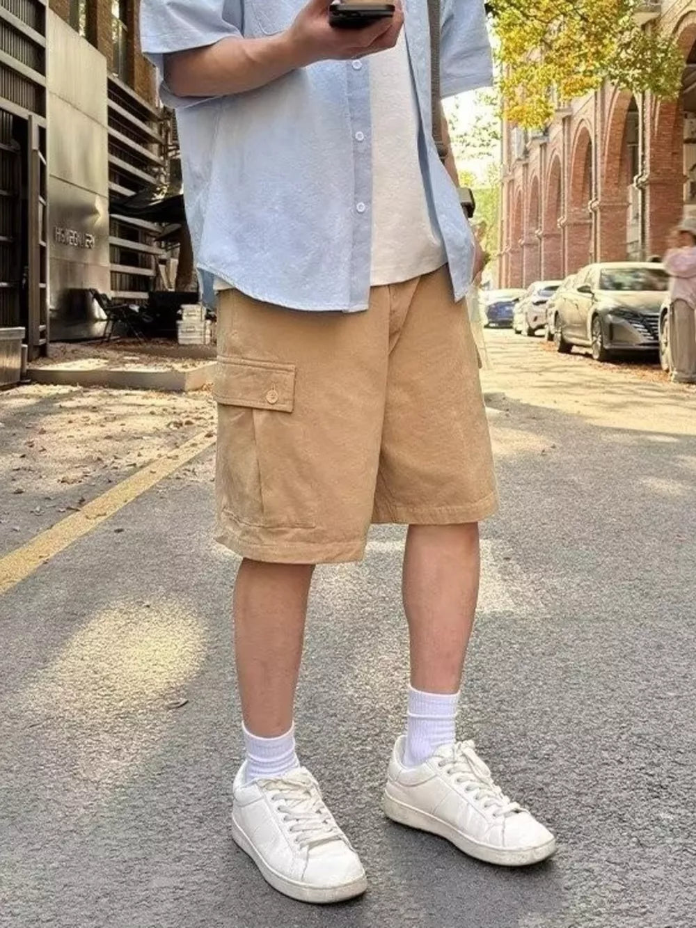 Camel relaxed fit cargo shorts with flap pocket above the knee