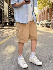 Camel relaxed fit cargo shorts with flap pocket above the knee