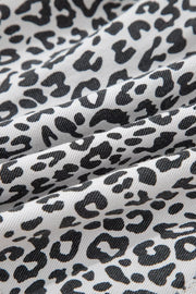 Leopard print denim skort with pockets in black and white cotton.