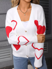 White acrylic knit cardigan with red heart pattern, button up front, V-neck.