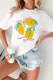 White polyester t-shirt with a cheerful lemon graphic and text.