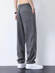 Relaxed fit gray cargo pants with elastic waist and back pocket detail.
