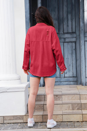 Distressed crimson denim overshirt with frayed hem and distressed detail on back shoulders.