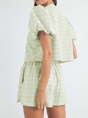 Light green plaid puff sleeve crop top and shorts set with tie front detail.