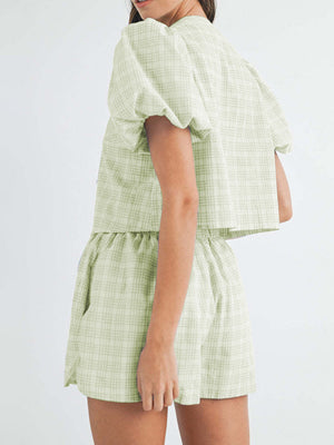 Light green plaid puff sleeve crop top and shorts set with tie front detail.