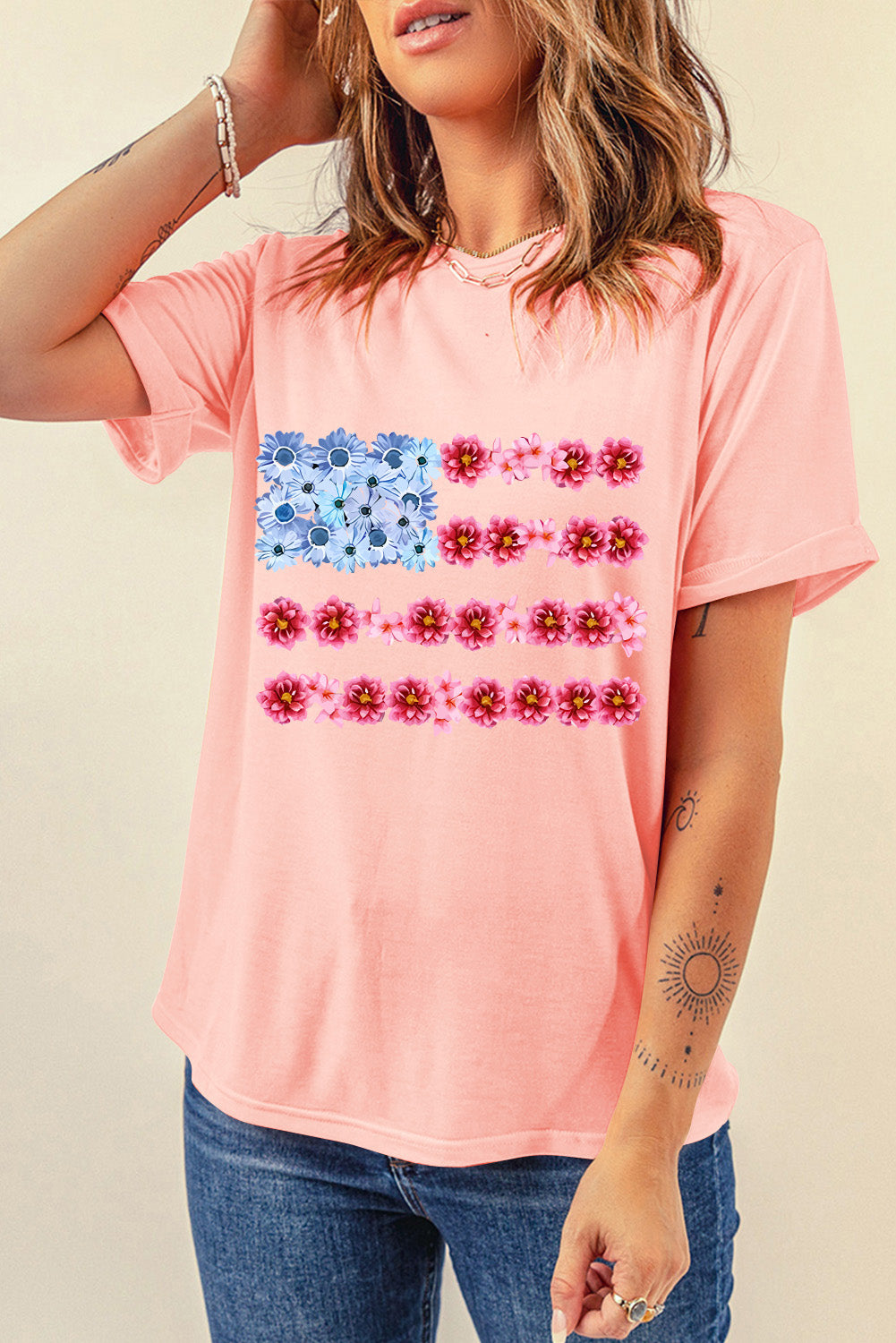 Floral flag graphic tee in watermelon pink cotton with blue and pink flowers.