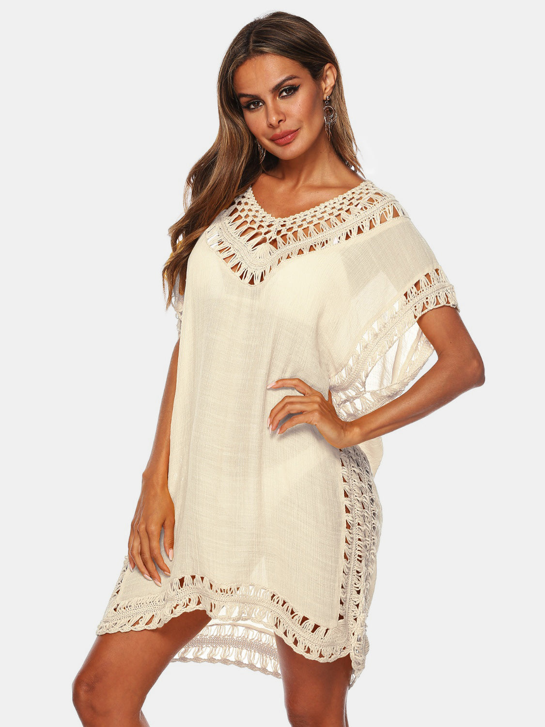 Cream kaftan cover-up with crochet trim and V-neck, perfect for beachwear.