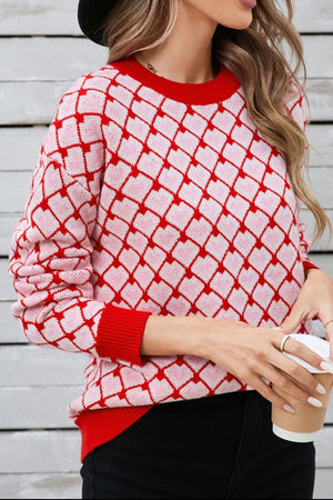 Heart Grid Crewneck Knit sweater in pink and red acrylic with a diamond heart pattern.