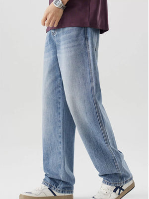 Men's relaxed fit light blue washed cotton jeans with a casual style.