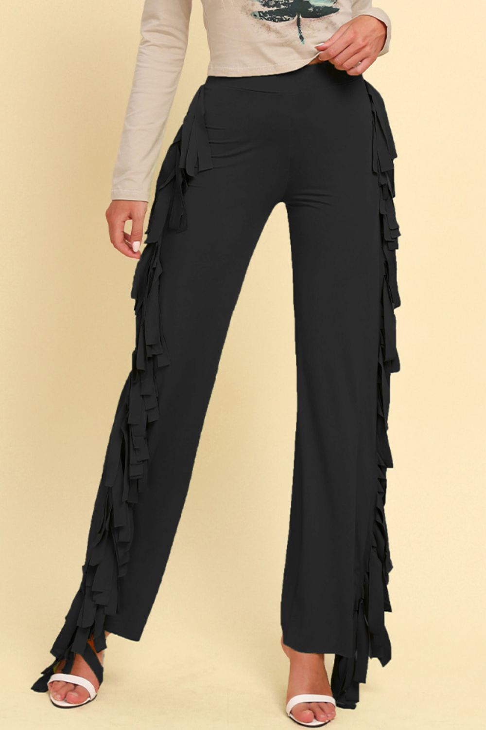 Black fringed palazzo trousers with cascading fringe detail down the sides.