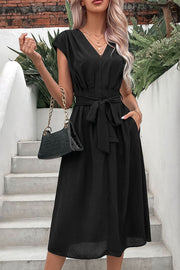 Black cap sleeve wrap midi dress with belted waist and pockets.