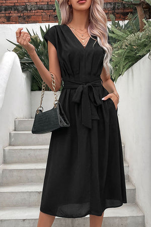 Black cap sleeve wrap midi dress with belted waist and pockets.